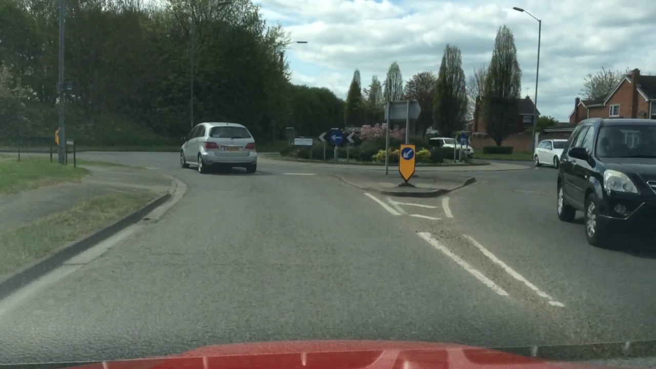 Pulling up on right side of road, reverse 2 car lengths then drive off driving manouevre