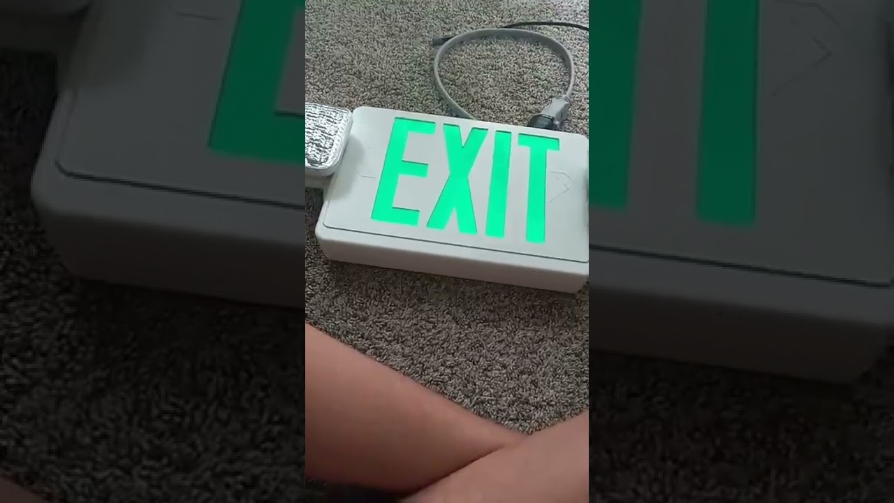 replacing an exit sign battery.and testing.working