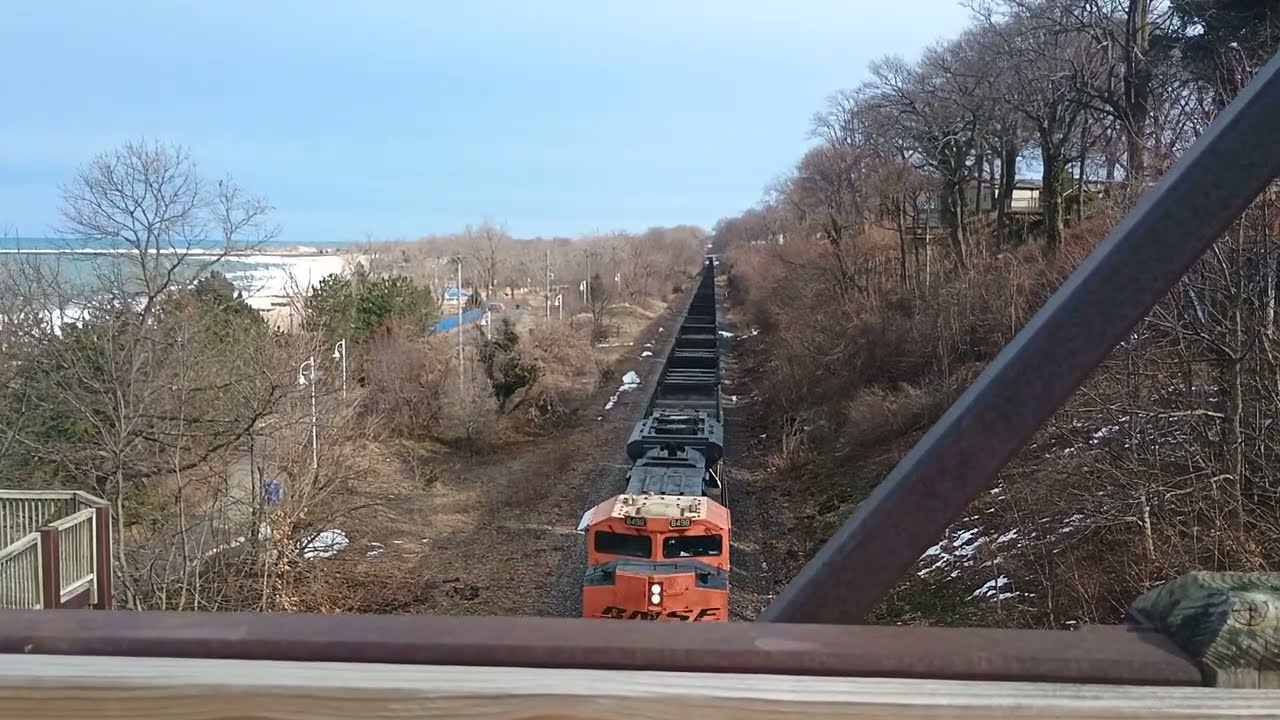 Empty coal train rolls under Lions Park Footbridge in St. Joseph MI