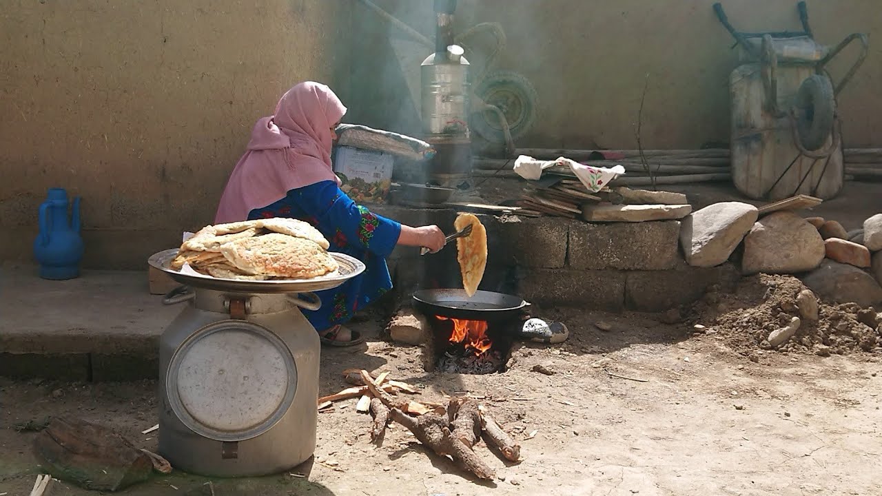 traditional Afghanistan food bolani_village life style_having and making  tradational stove in home.