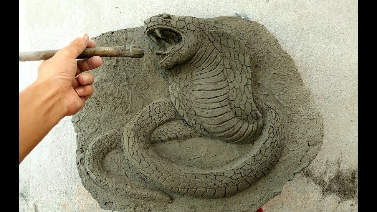Amazed when he finished the lifelike cement cobra