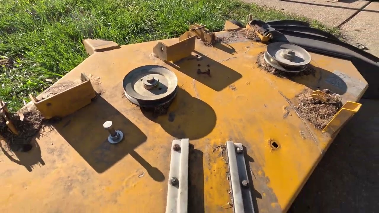 Hustler Mower Deck Idler Pulley Replacement and bent deck repair.