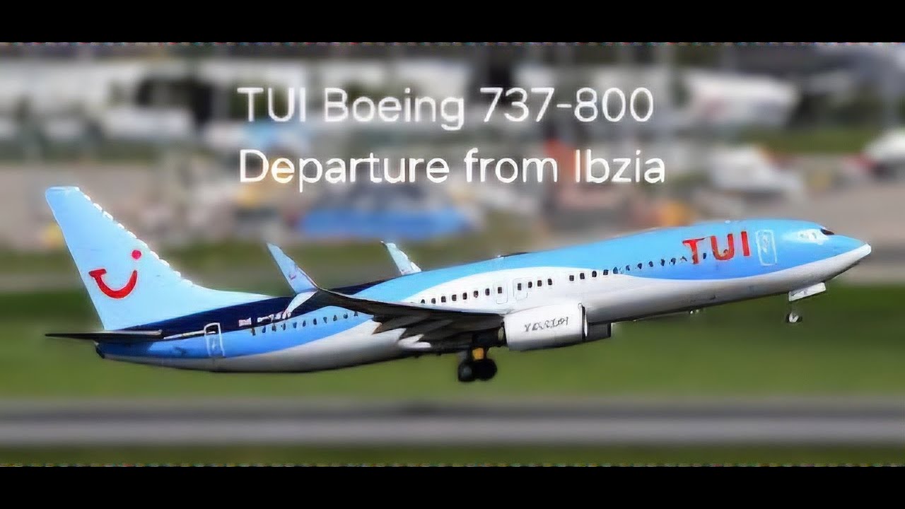 TUI Boeing 737-800 departing ibiza for Birmingham taking off over the stunning island