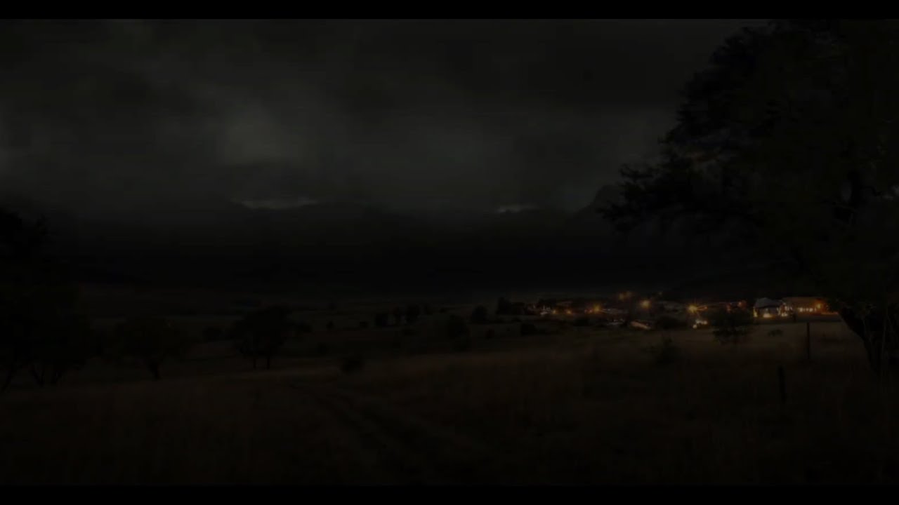 Thunder Rumbling Over The Valley At Night, Echoing Across The Grasslands, With Village Lights