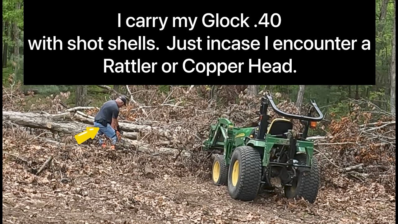 John Deere 2520 did a great job helping me clear the down trees. #husqvarna #johndeere #logsplitterb