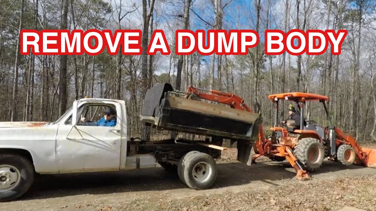 How to take a dump body off a Chevy R30 Dump Truck with a Kubota L39 backhoe. Remove a dump body.
