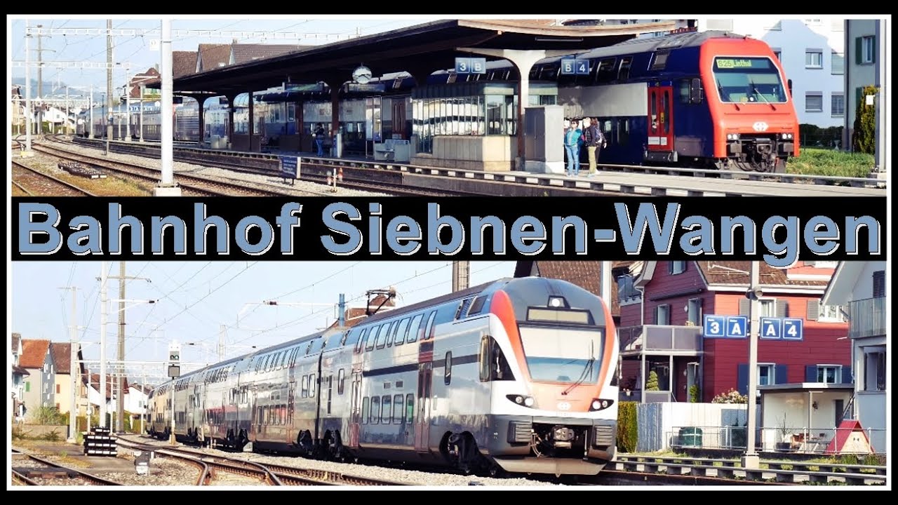 Postautos und Z&uuml;ge beim Bahnhof Siebnen-Wangen, Kanton Schwyz, Schweiz 2021