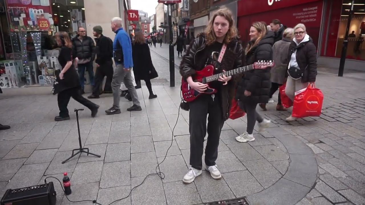 Christian plays White Room by Cream in Church Street Liverpool
