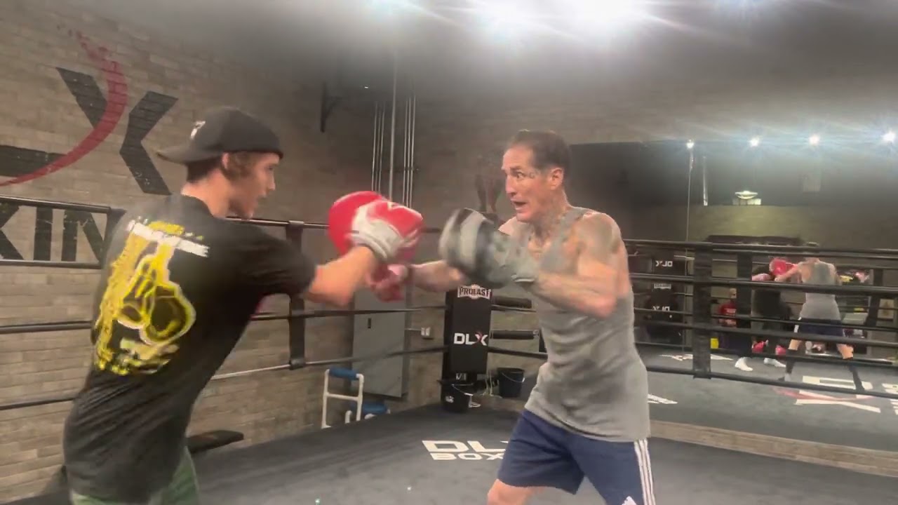 Paul Spadafora and son Geno hand pad work