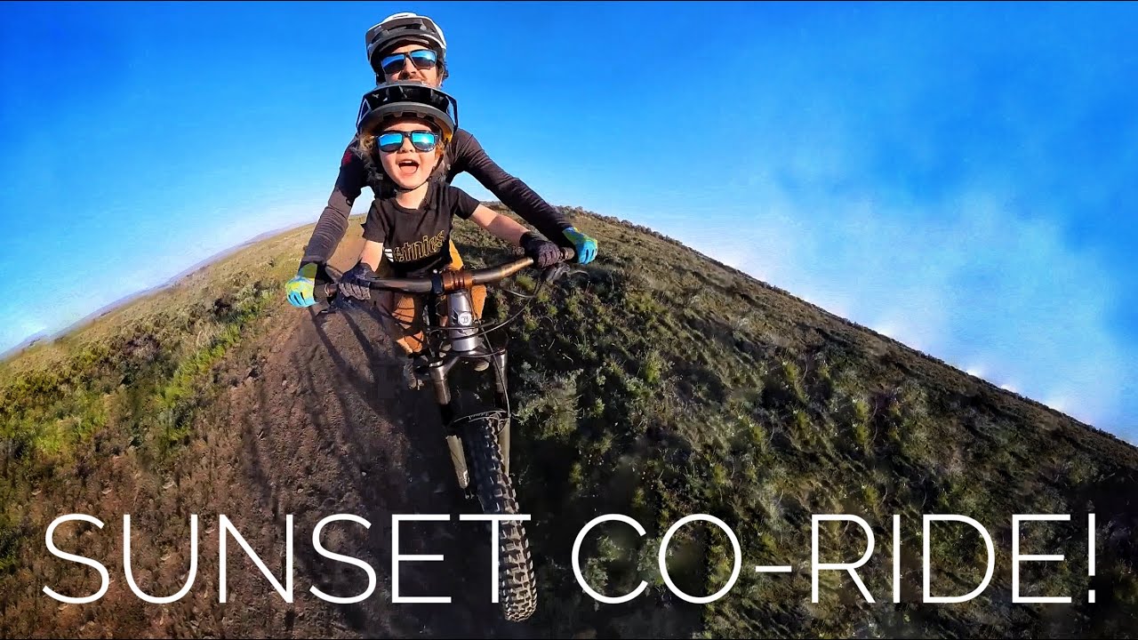 Father & son embark on a sunset mountain bike ride
