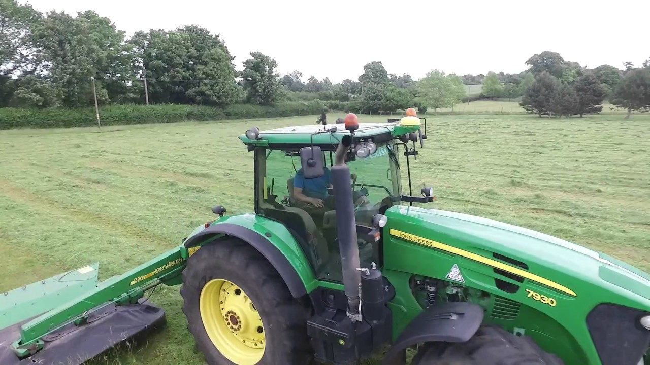 2 x john deeres mowing grass for hay