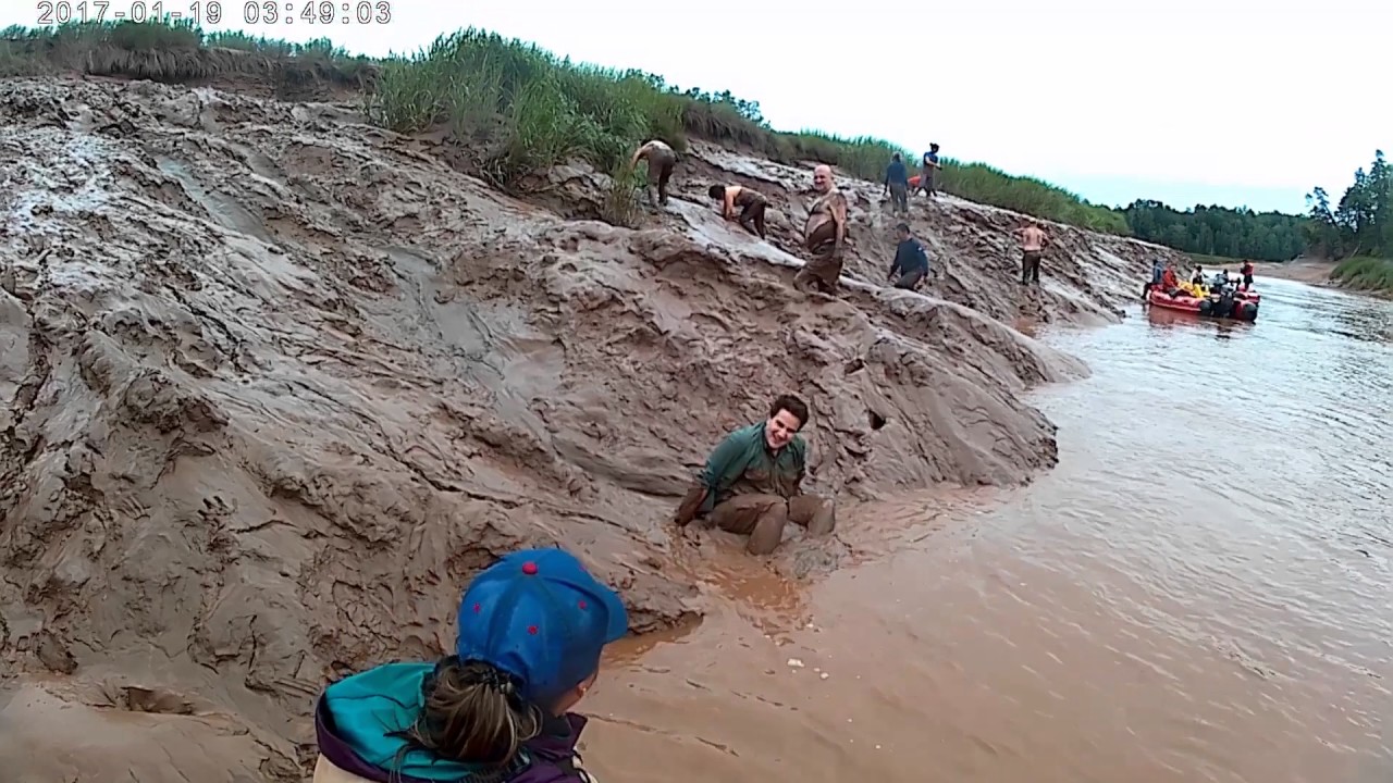 Mud-sliding on the banks of the Shubie in Nova Scotia