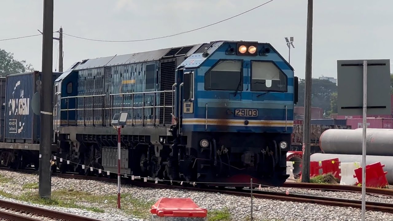 KTMB Class 29103 Merbau locomotive with a fleet of container  and flatbed wagons from West Port.