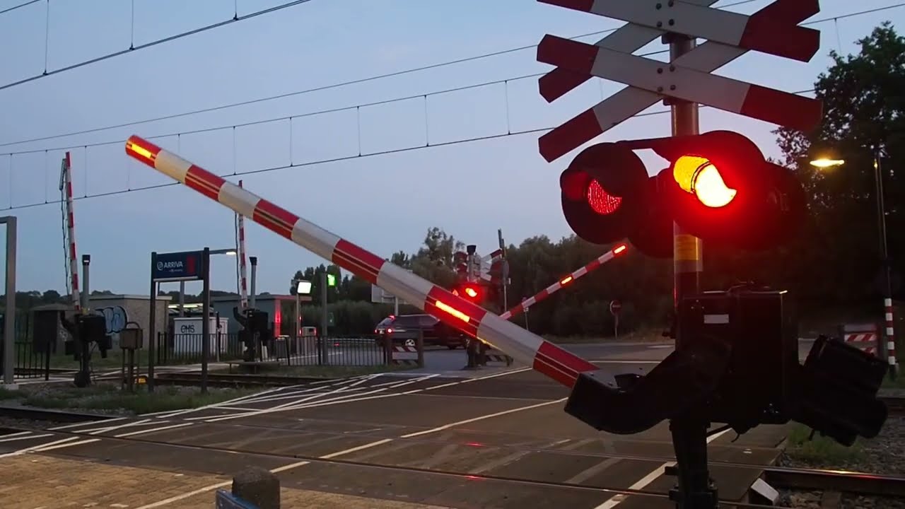 Car, pedestrian and platform booms at Spaubeek station in the Netherlands