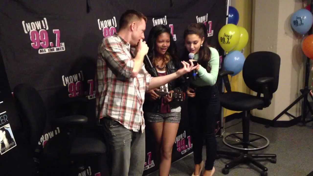 Ariana Grande sings with one of her fans