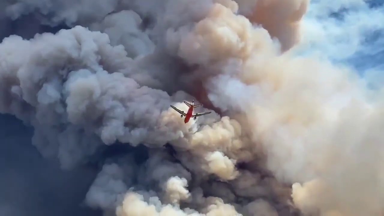 Plane Drops Retardant Over California’s Apple Fire as Blaze Prompts Thousands to Evacuate