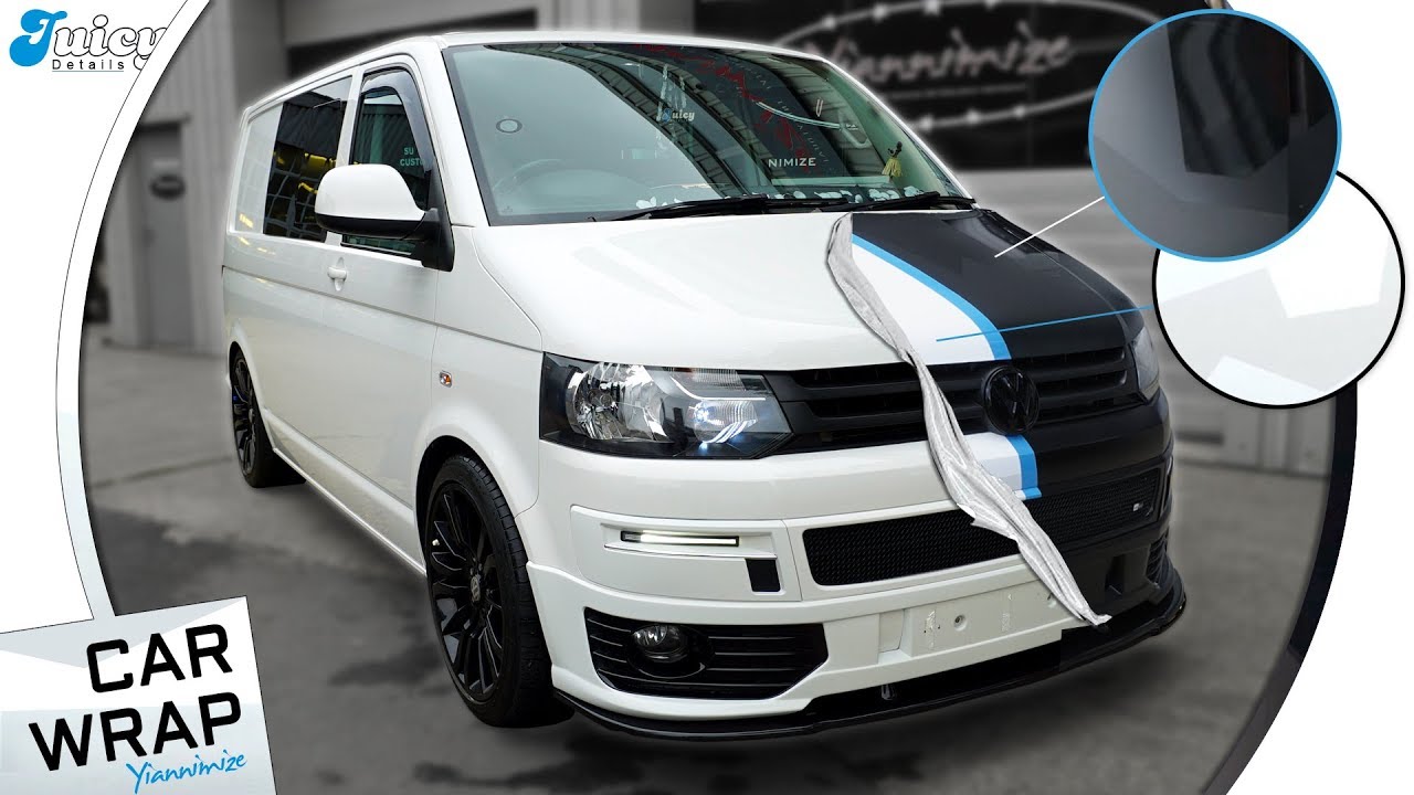 VW Transporter Van wrapped Half Black Camo, Half White Camo