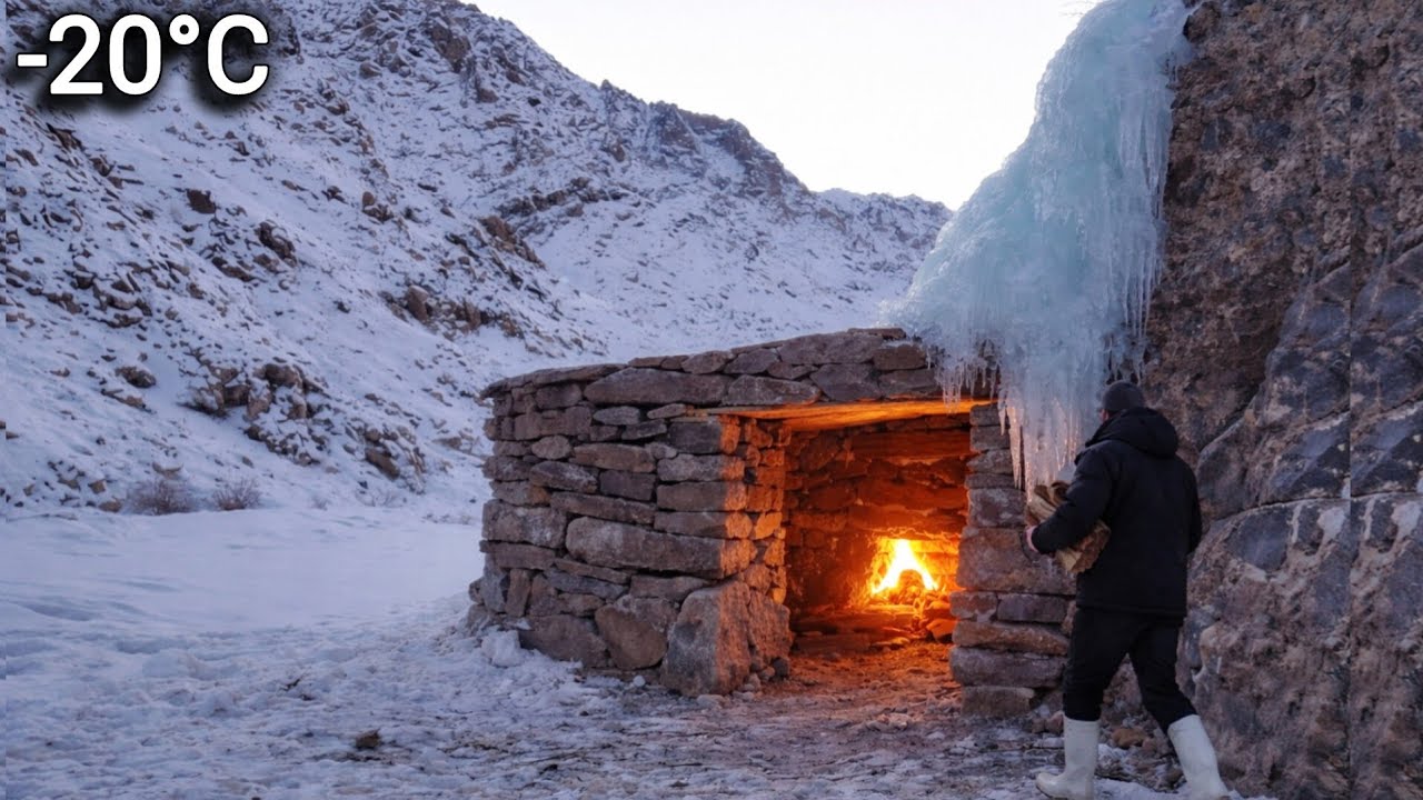 Stone Shelter by the Rock in Snowy Mountains with Warm Fire in Extreme Cold