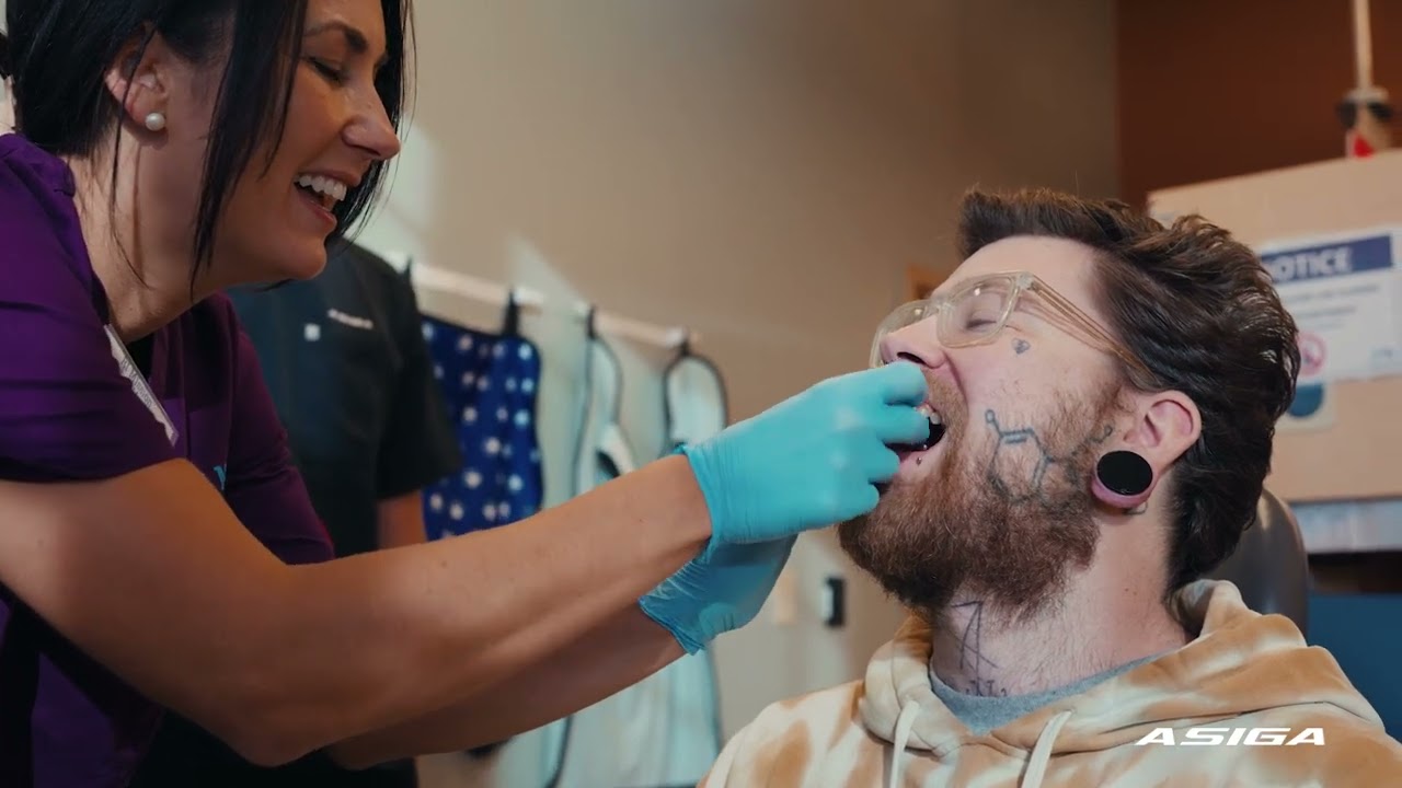 Asiga providing a helping hand at the Rhode Island Mission of Mercy.