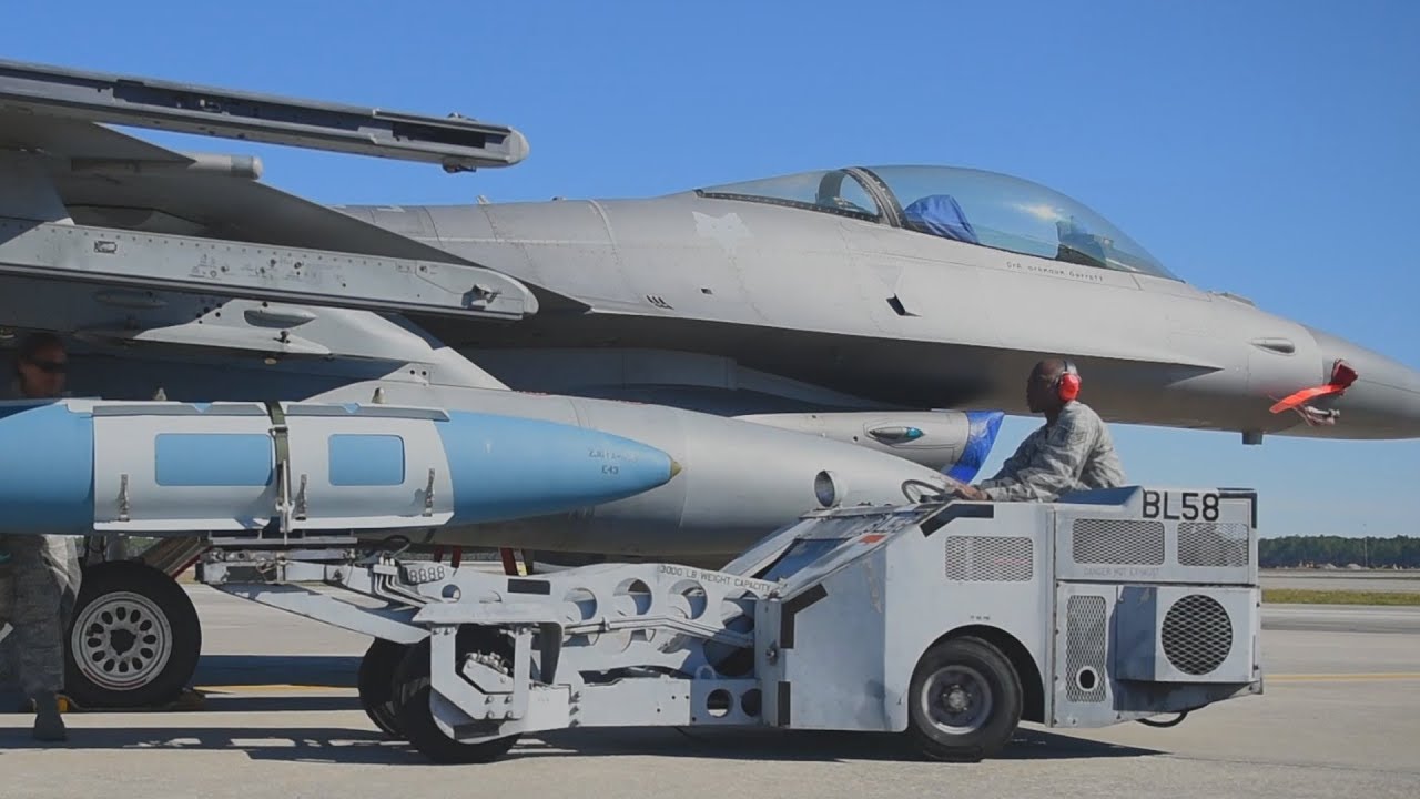 Airmen show how to LOAD LATEST SOPHISTICATED WEAPONS onto fighter jets!