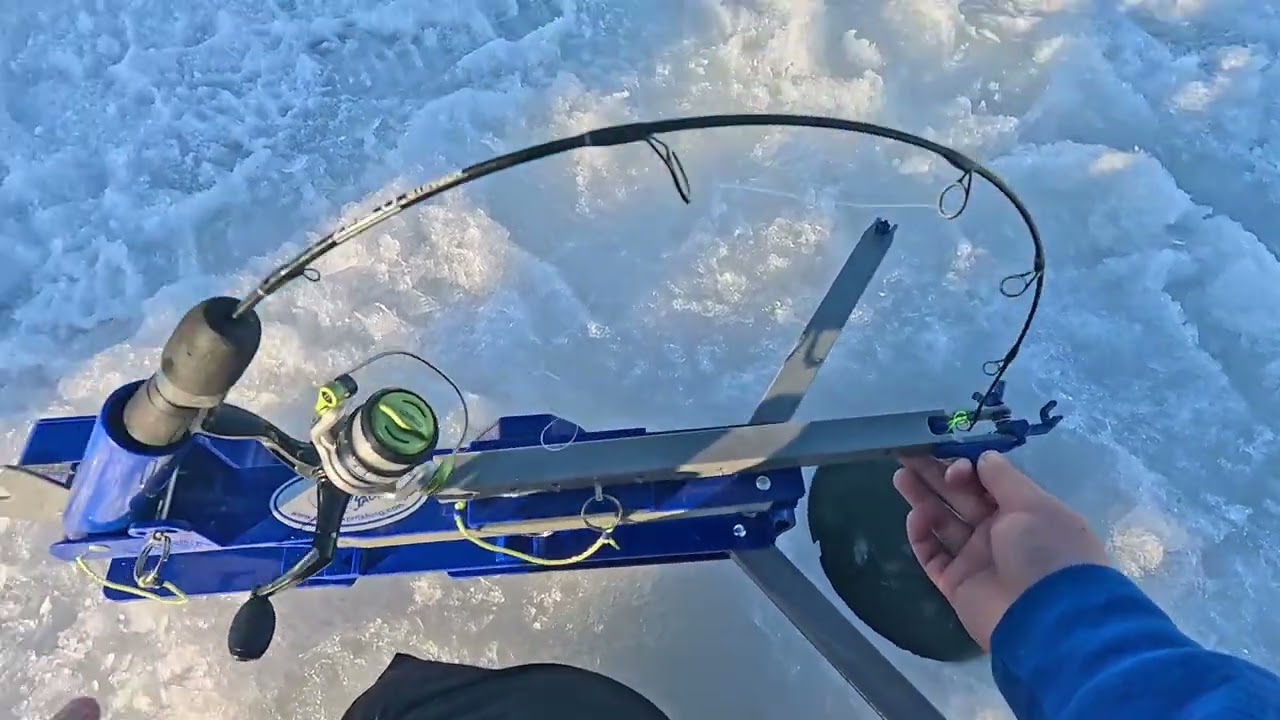 Ice fishing on a beautiful day with dad