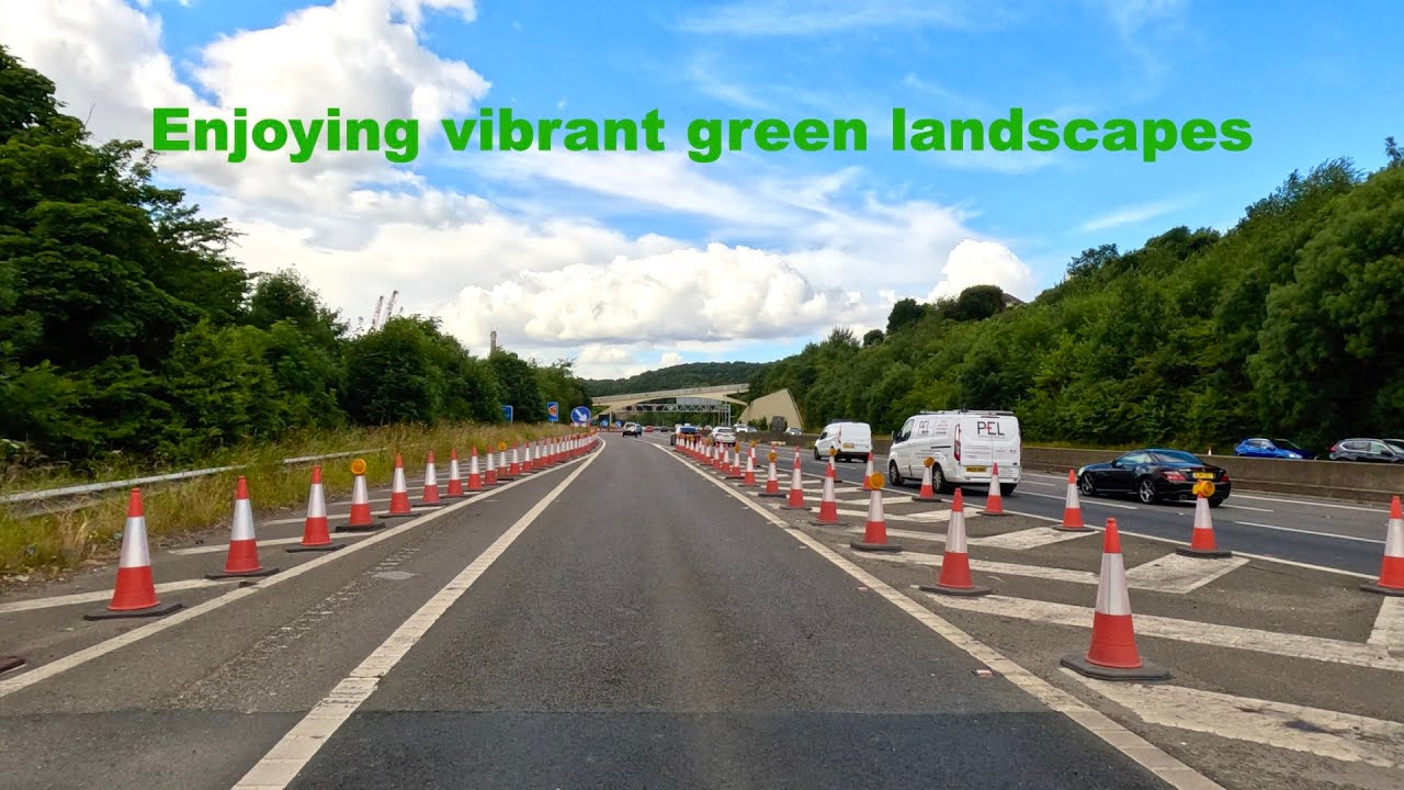Driving round M1 Motorway on a sunny Saturday afternoon in 4K
