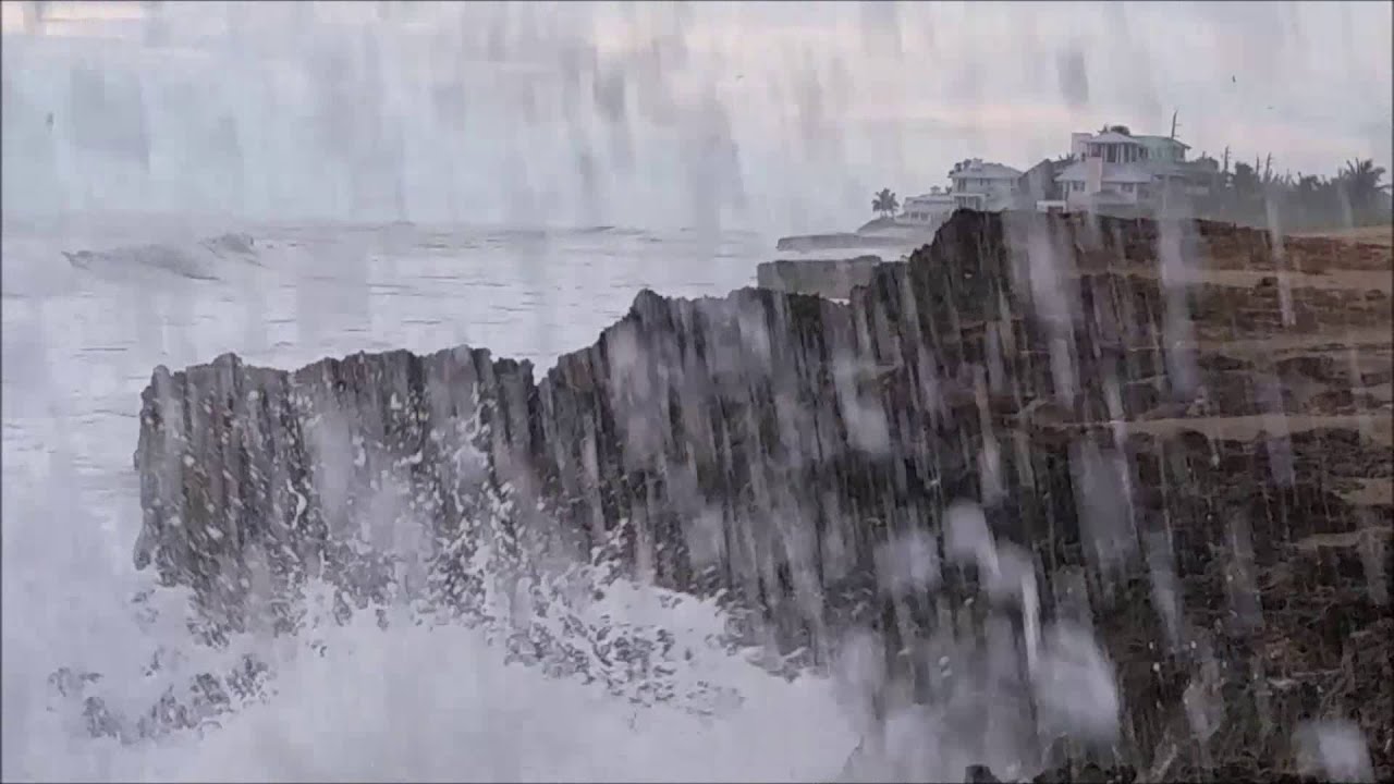 Waves crashing onto rocky shore at the House of Refuge, Hutchinson Island, Stuart Florida