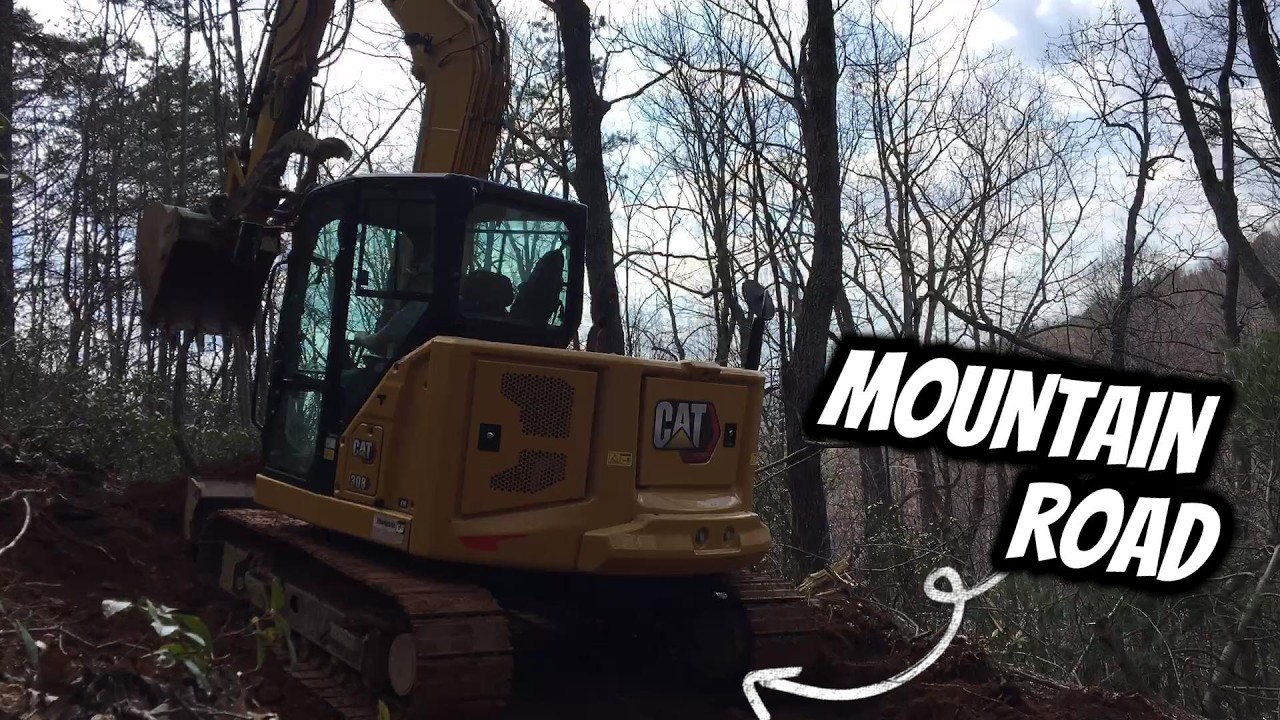 Прокладка горных дорог с помощью экскаватора CAT 308
