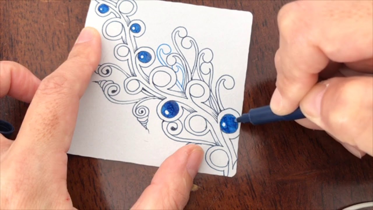 Zentangle started “Dewd” on the gray tile.