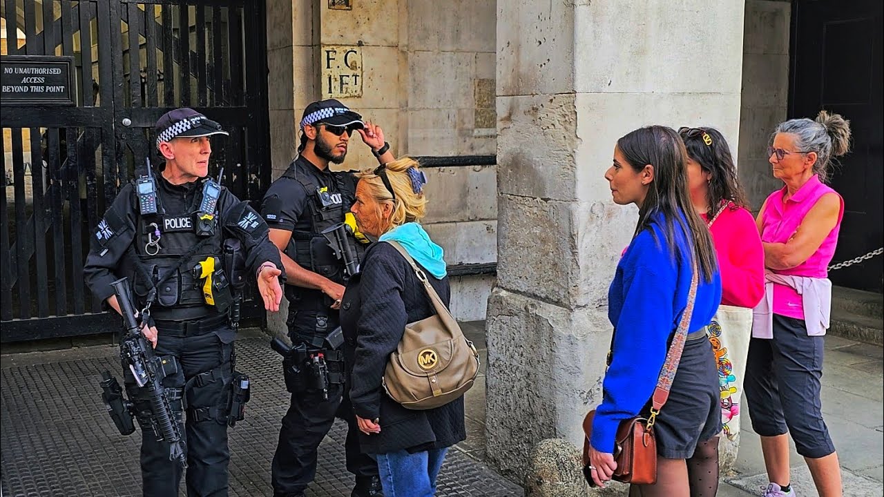 POLICE TO TOURISTS: THIS AREA IS OUT OF BOUNDS, DON'T STEP HERE! long faces at Horse Guards!