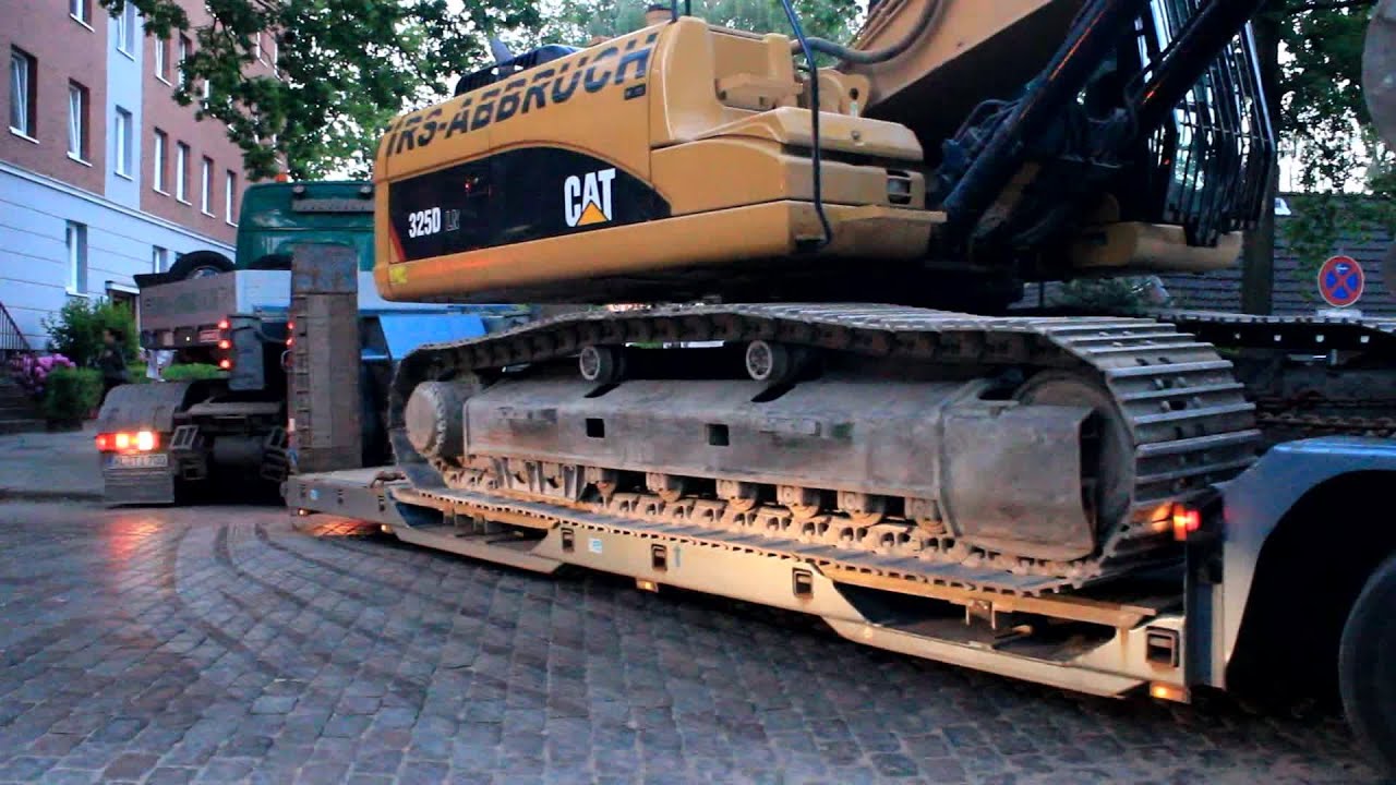 BAGGER VERLADUNG AUF SCHWERTRANSPORT +++ CAT 325D TIRS ABBRUCH