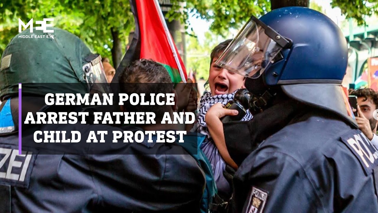 German police arrest father carrying his child during a pro-Palestine protest