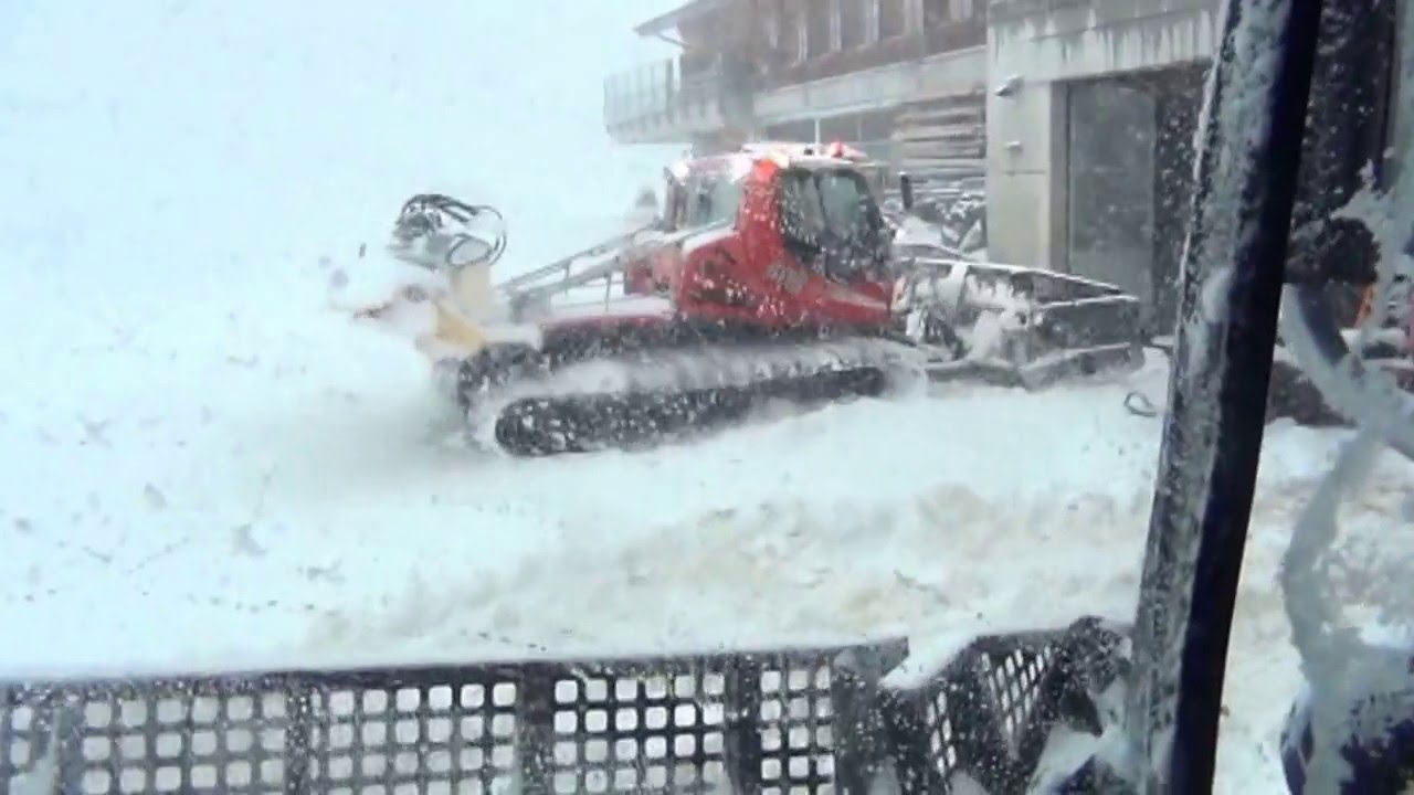 Switzerland Meiringen Hasliberg driving in a PistenBully