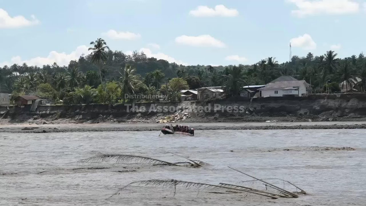 Relatives of flood victims await news of loved ones after Indonesia floods kill hundreds