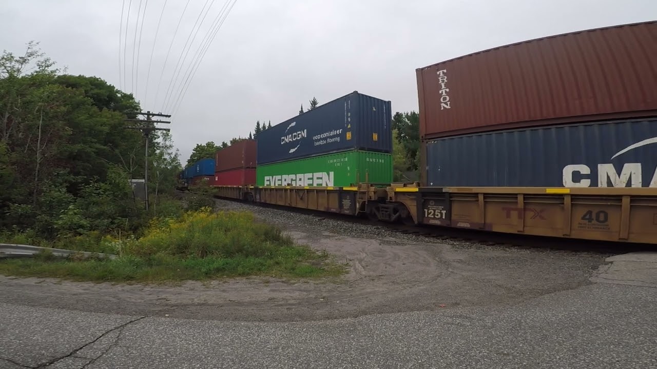 slow southbound CN intermodal with a nice horn passing Isabella street Parry sound