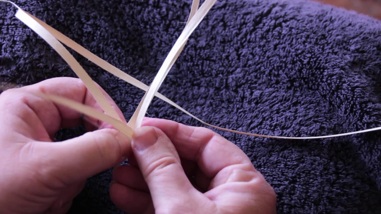 Cabbage tree hat making - trimming