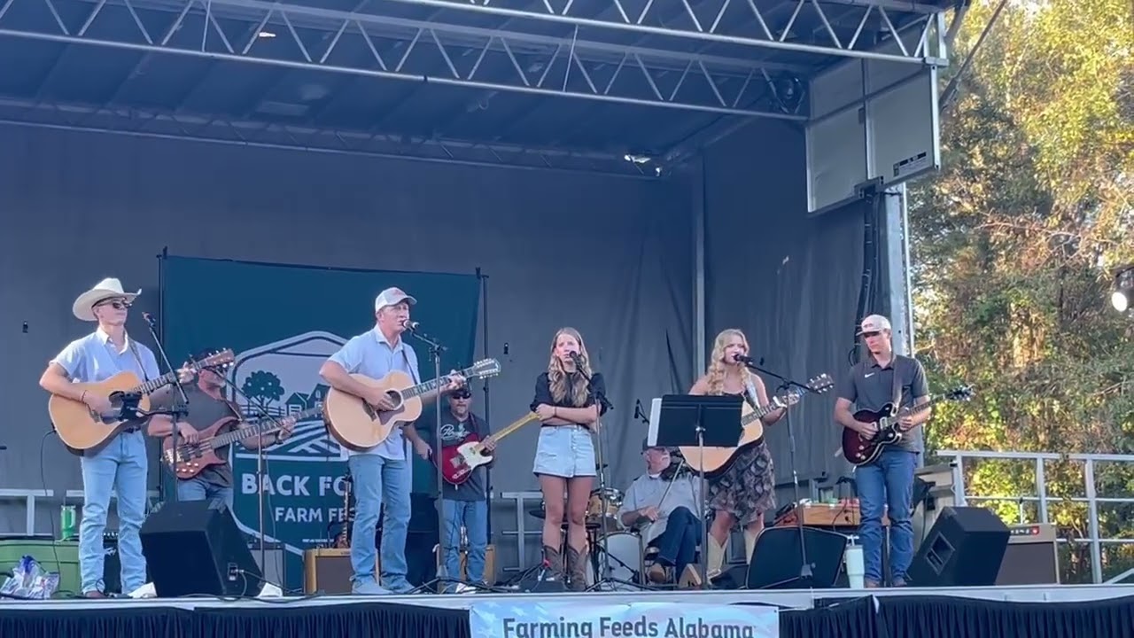 Elizabeth sings her song “You Know When You Know” at the Back 40 Farm Festival