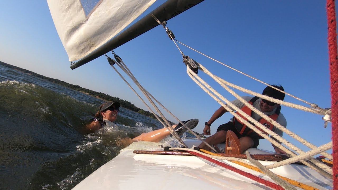 Force 5 racing a laser fast and fun, STAY ON THE BOAT.  Man over board, well woman over board twice