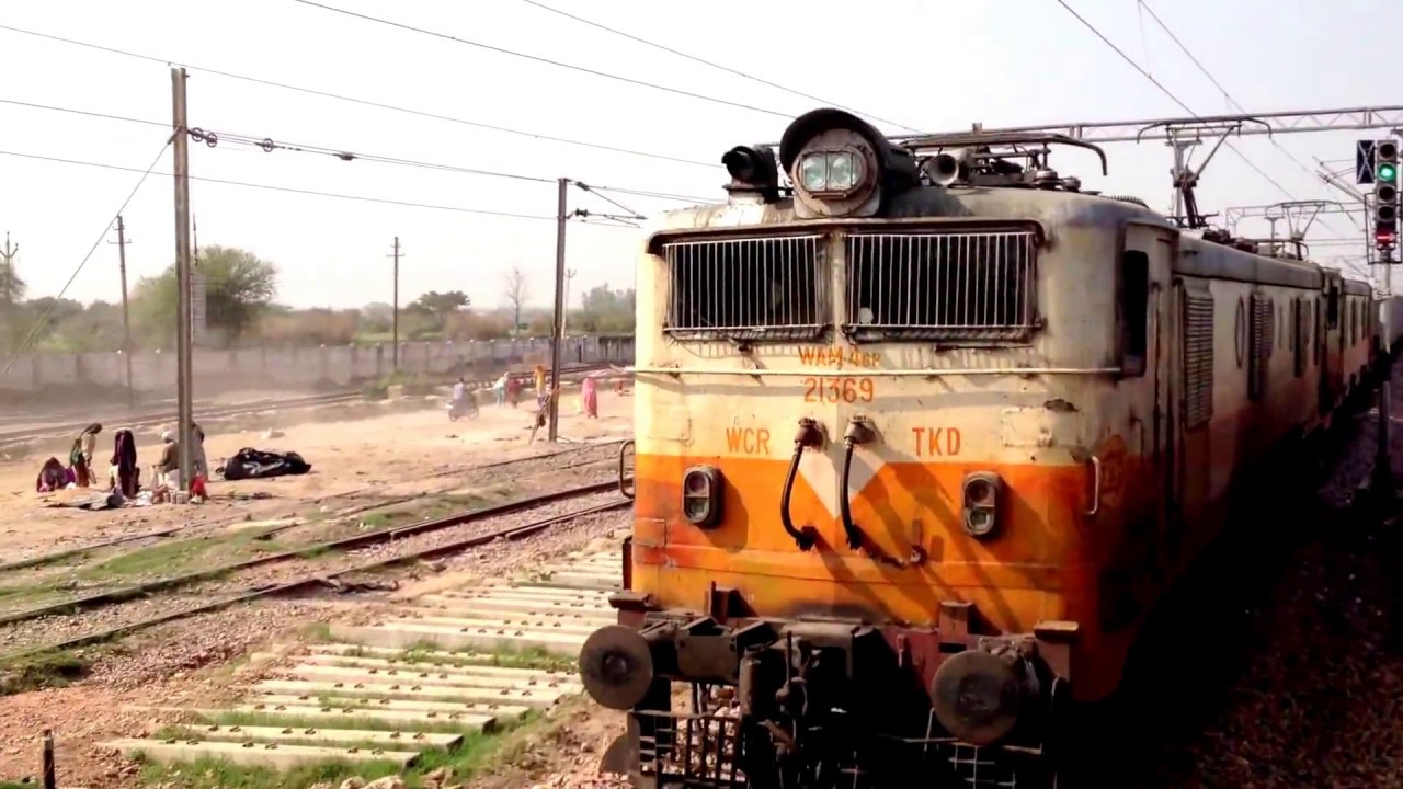 INDIAN RAILWAYS (1-clip) 5 clips of WDP4B 40072 locomotive across rural stations in North India