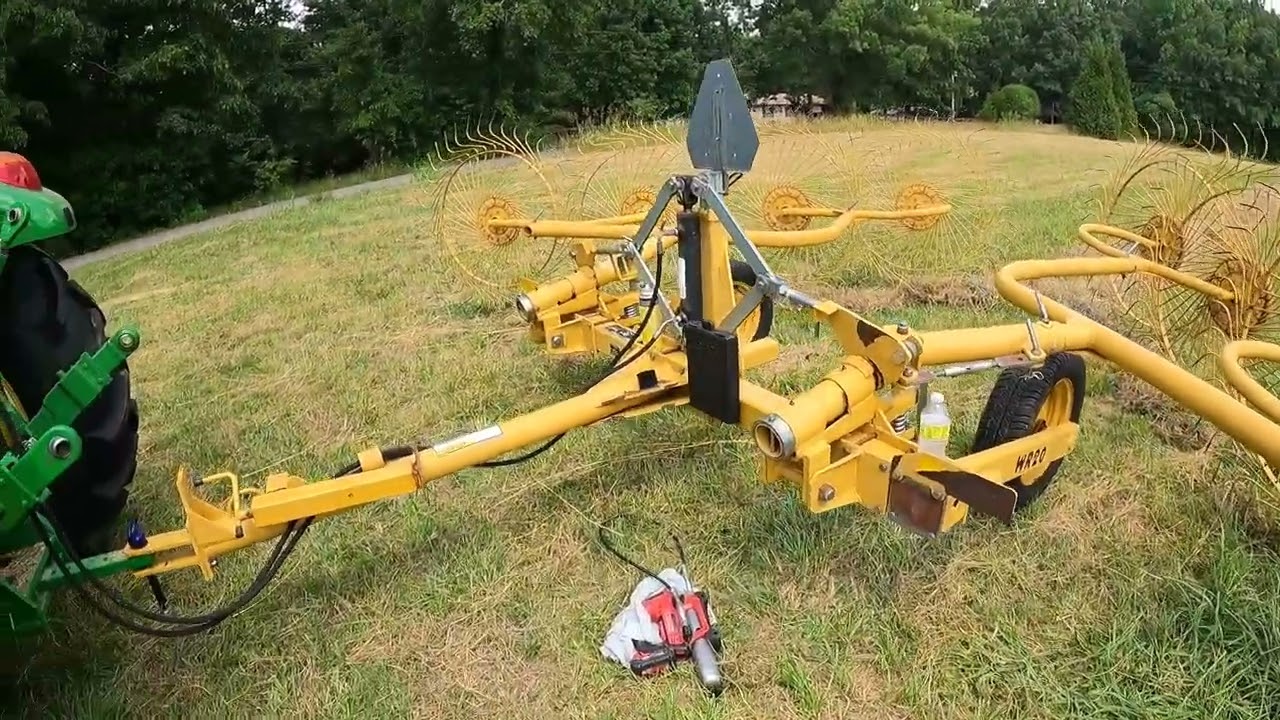 5075E raking hay with Vermeer WR20