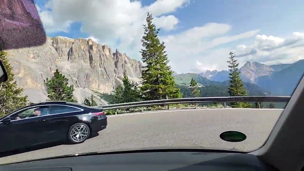 Dolomites Passo Sella in Italy- downhill with a car