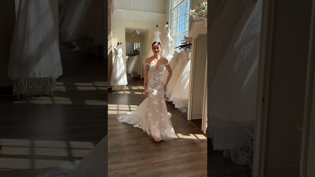 Bold lace, off-shoulder straps, a low illusion back - we love this romantic fitted gown so much!💕