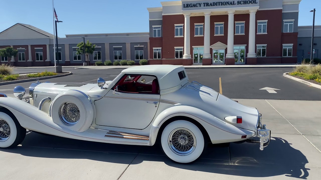 White Excalibur Roadster with Rumble Seat