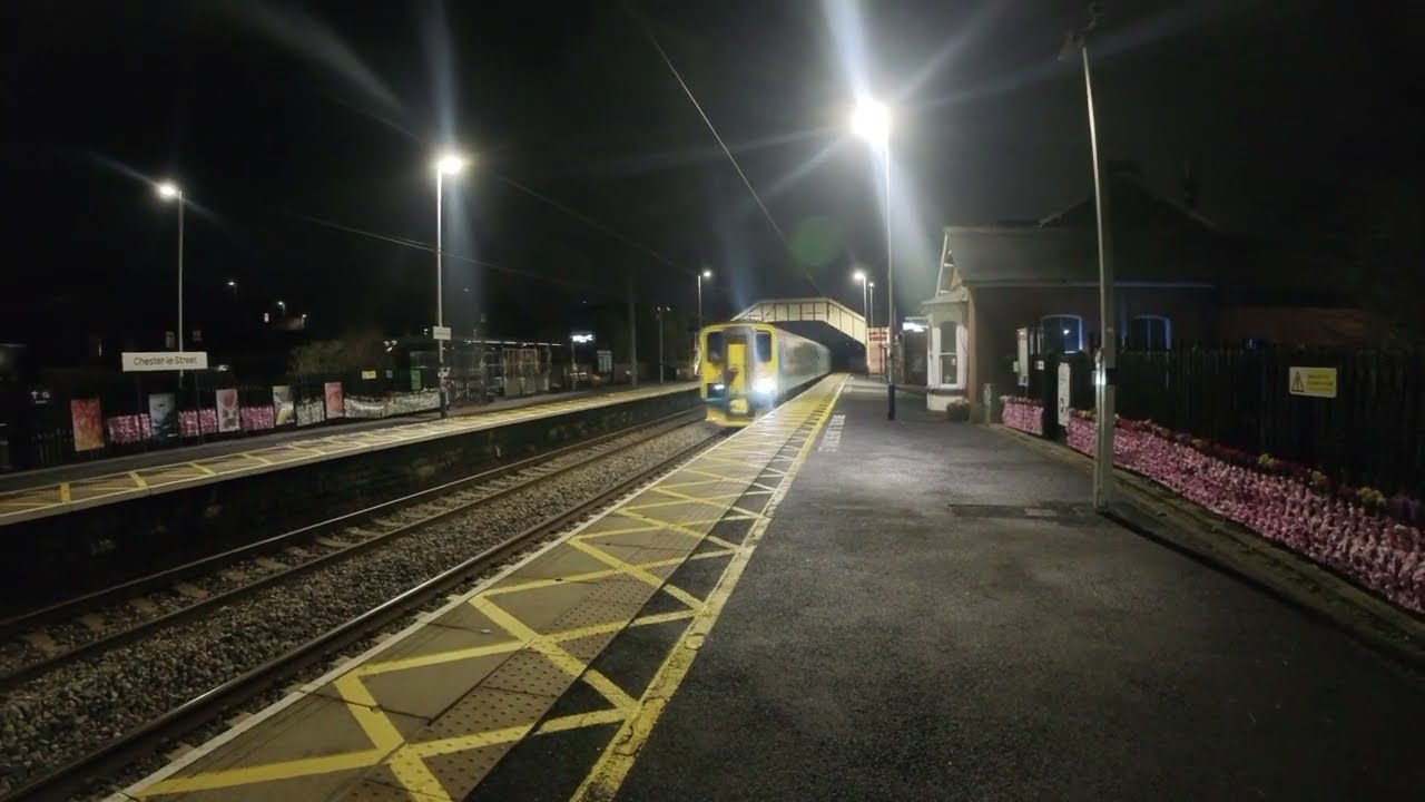 A cold winter night  and  a Class 153 Network Rail  test train passing through Chester le Street.