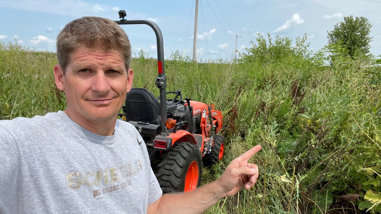 Brush hogging the overgrown jungle - Kubota B2601 - Bittersweet house flip - Part 1