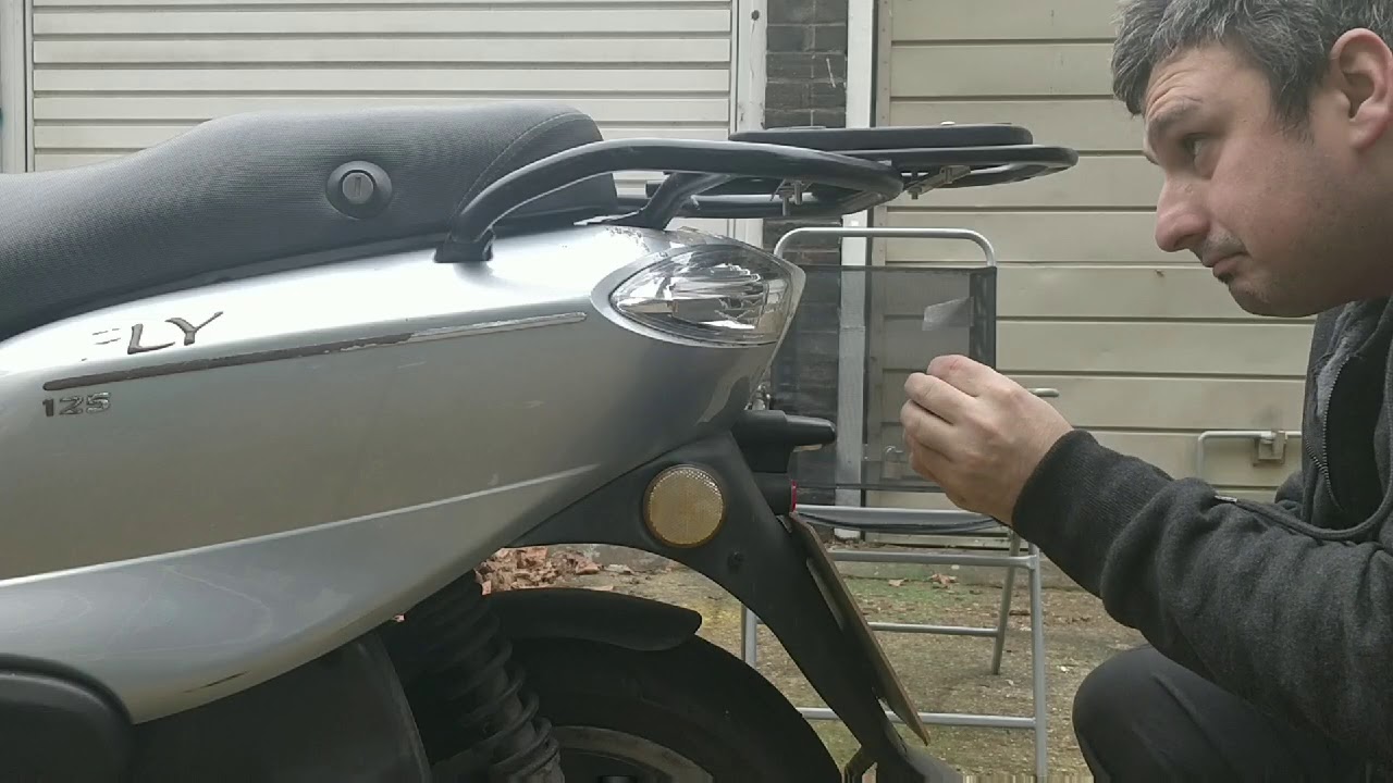 Motorcycle top box fitting, moped top box fitting. Universal top box fitting, how to fit a top box.