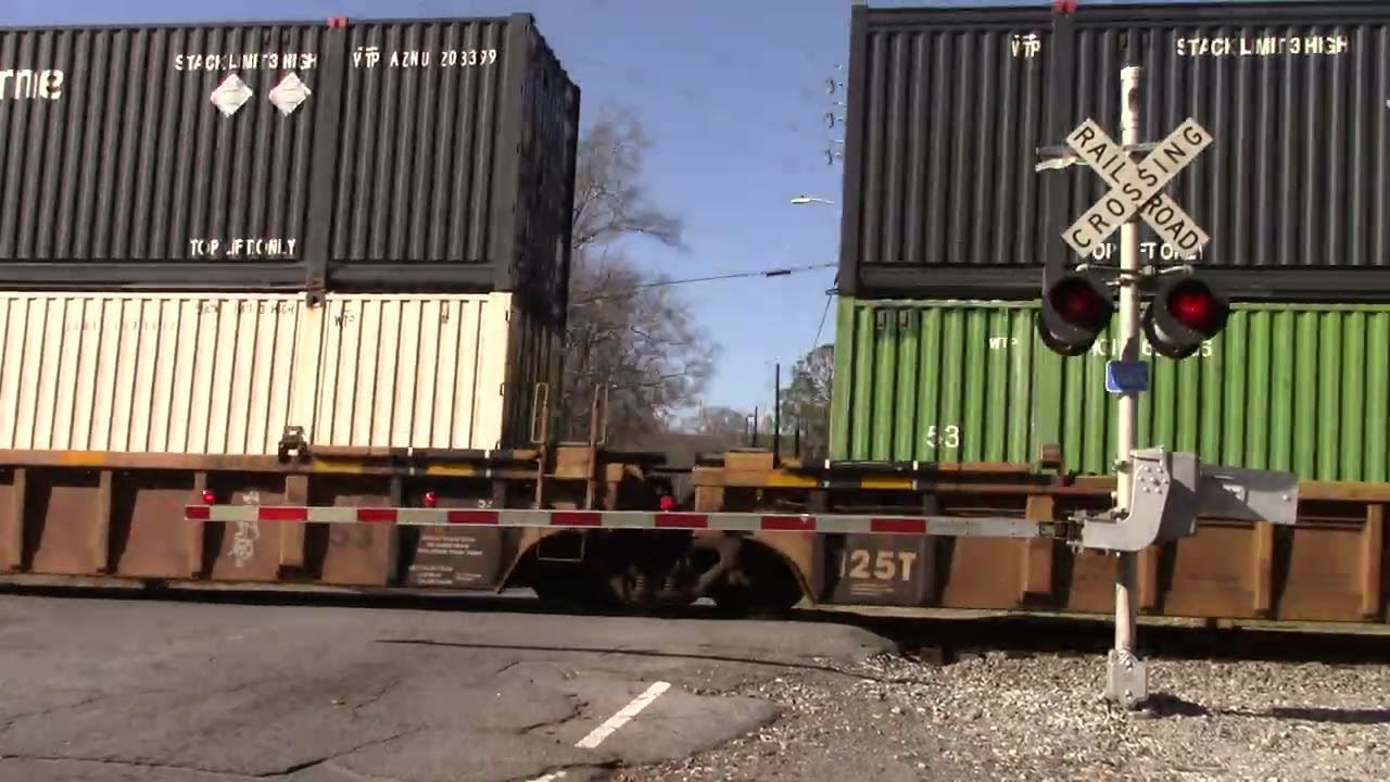 NS 7597 leads NS 29A at the Burlington Road Railroad Crossing in Shannon, GA