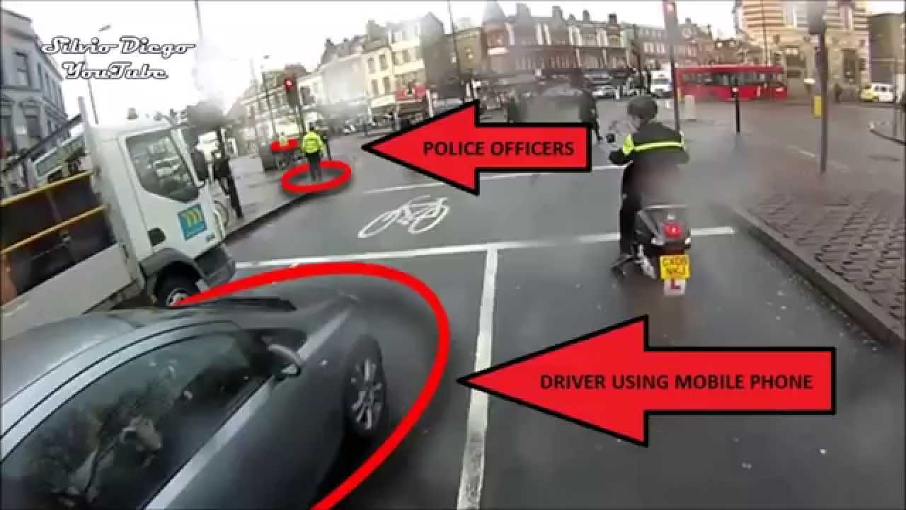 Uses Phone While Driving by Police Officers, Cop Reaction priceless!!