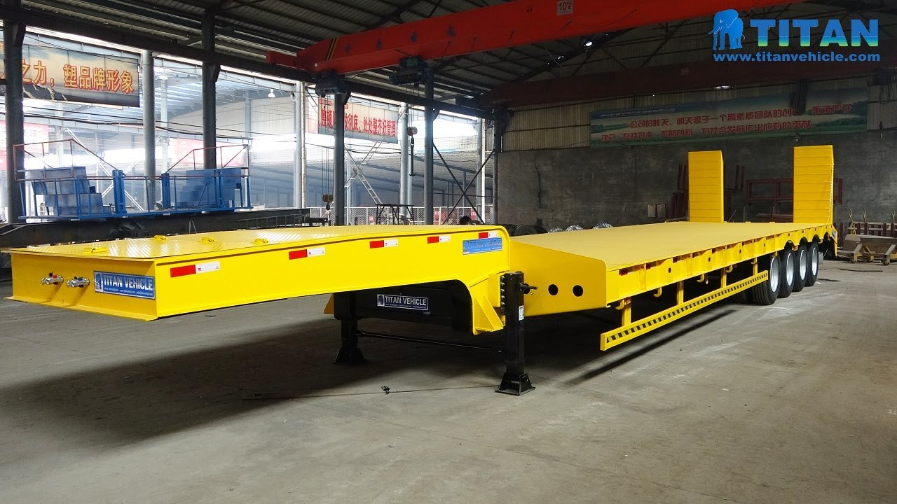 4 axle low loader | China 2/3/4 axles hydraulic ramps 80/100ton lowbed low flatbed semi trailer
