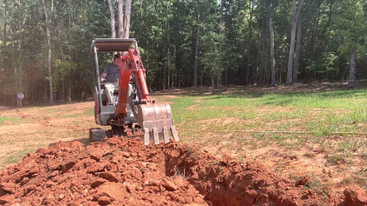 Kubota KX41-3V trenching for utilities